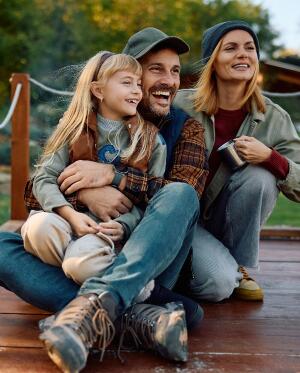 family hugging and smiling